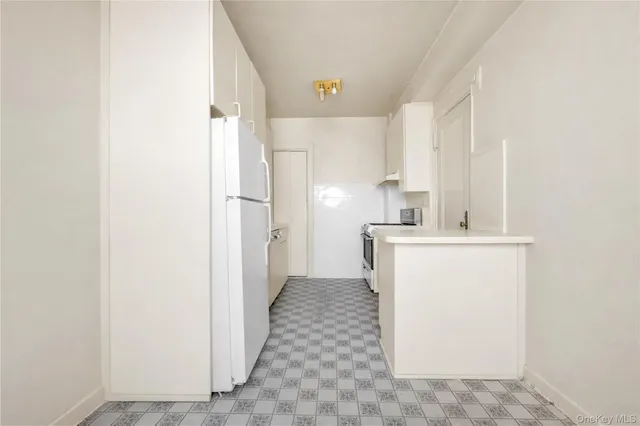 a kitchen with a refrigerator a sink and dishwasher