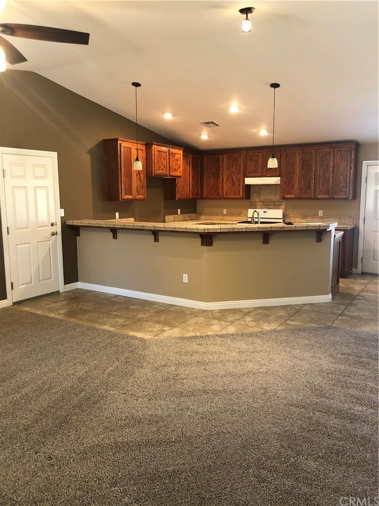 11612 Oasis Road Pinon Hills, CA 92372 - Photo 4 of 12 a view of kitchen with stainless steel appliances cabinets