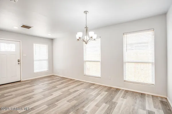 a view of a room with windows