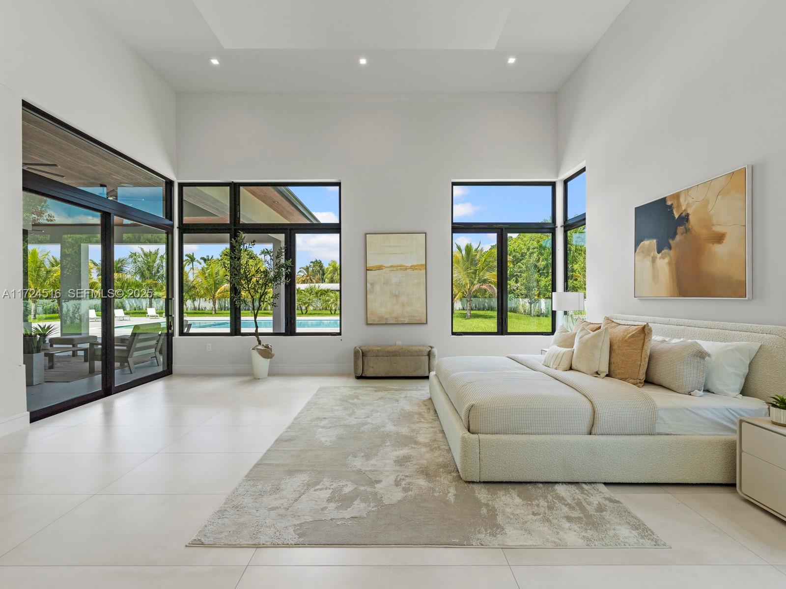 12025 Southwest 46th Street Miami, FL 33175 - Photo 13 of 45 a living room with furniture and large windows with outer view