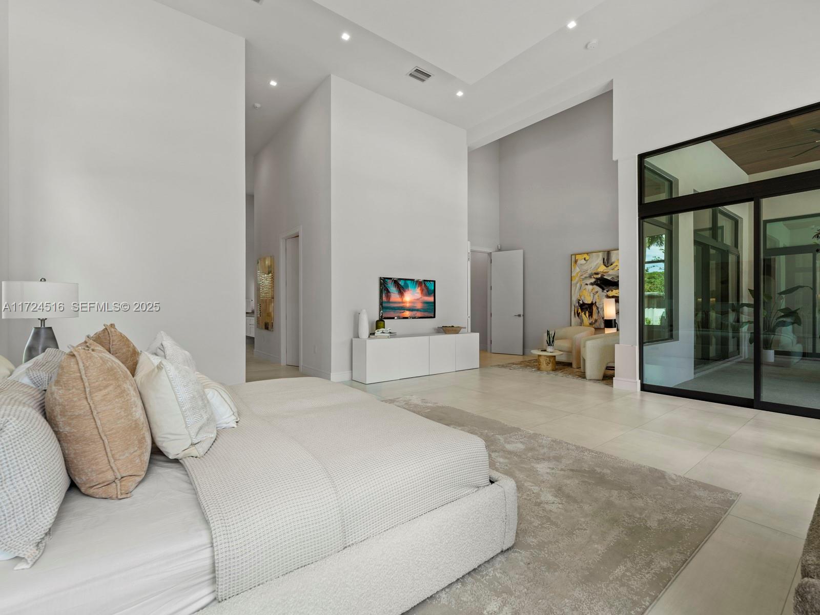 12025 Southwest 46th Street Miami, FL 33175 - Photo 15 of 45 a bedroom with a bed and a walk in closet