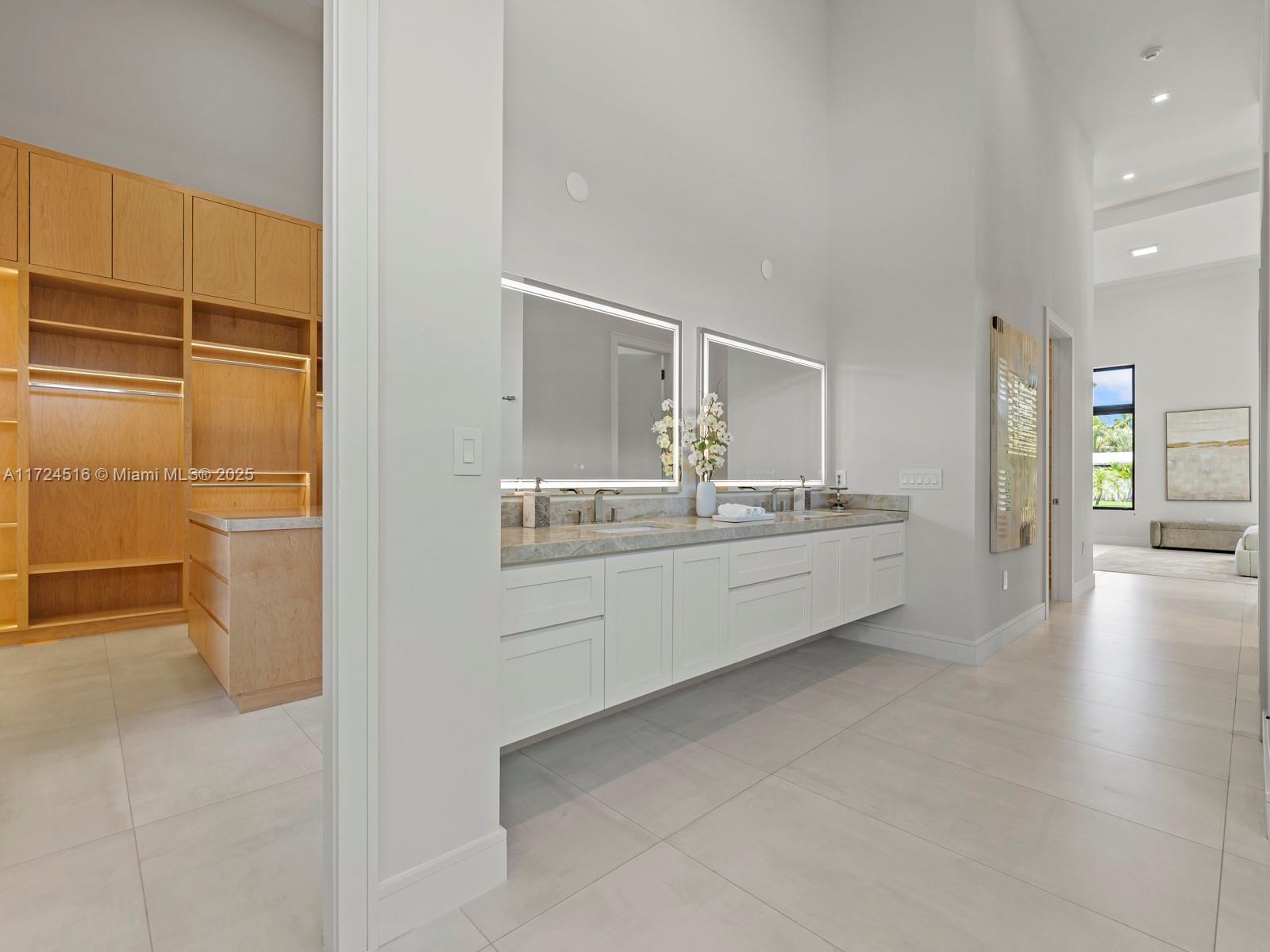 12025 Southwest 46th Street Miami, FL 33175 - Photo 19 of 45 a bathroom with a sink a mirror and a bathtub