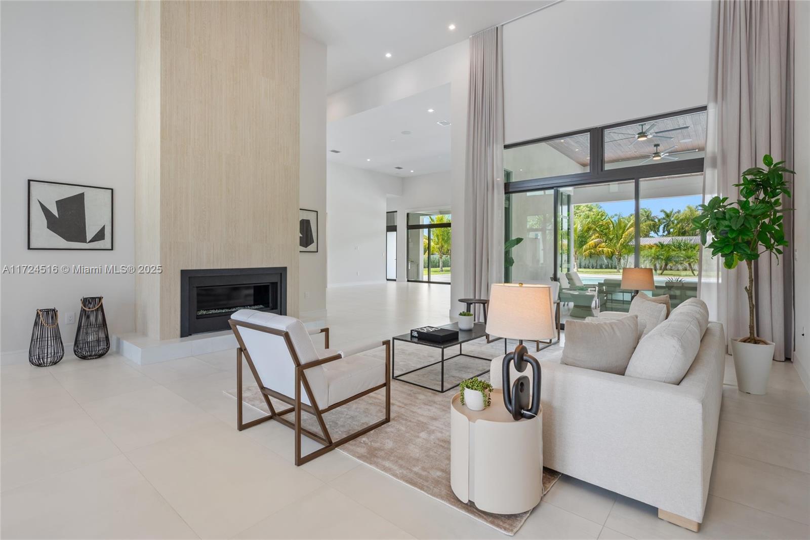 12025 Southwest 46th Street Miami, FL 33175 - Photo 3 of 45 a living room with furniture and a large window