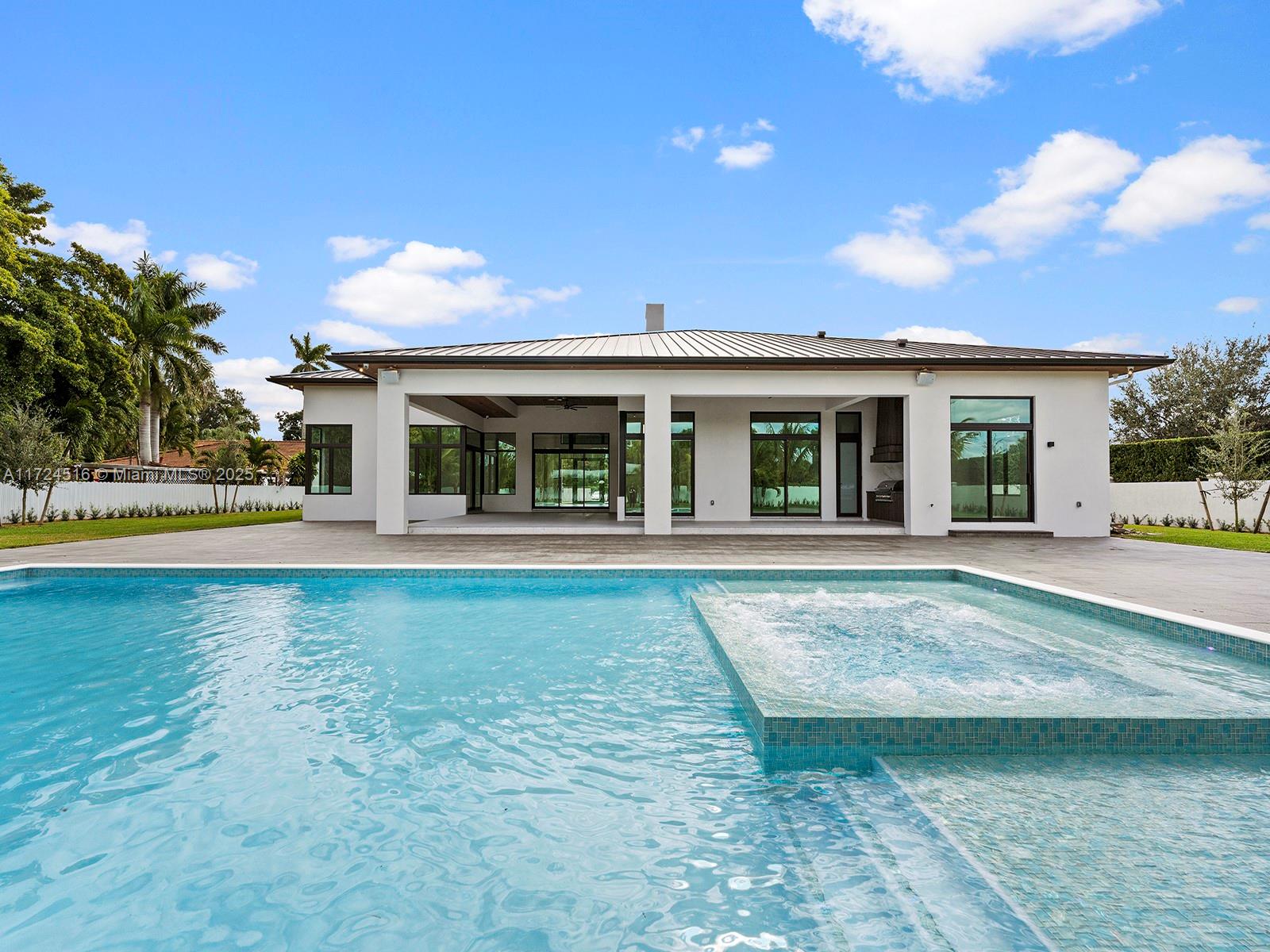 12025 Southwest 46th Street Miami, FL 33175 - Photo 40 of 45 a view of house with swimming pool outdoor seating