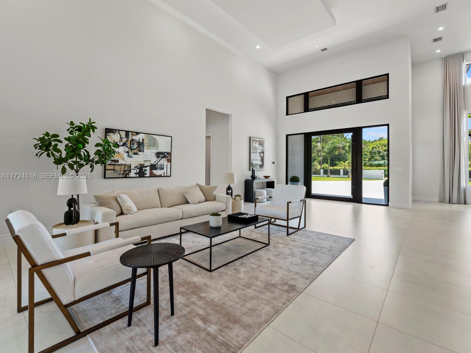 12025 Southwest 46th Street Miami, FL 33175 - Photo 4 of 45 a living room with furniture and a large window