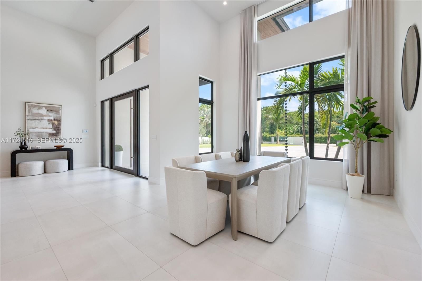 12025 Southwest 46th Street Miami, FL 33175 - Photo 5 of 45 a view of living room kitchen with furniture and large window