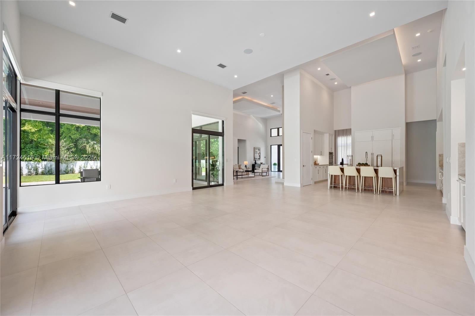 12025 Southwest 46th Street Miami, FL 33175 - Photo 7 of 45 a view of an empty room with a window