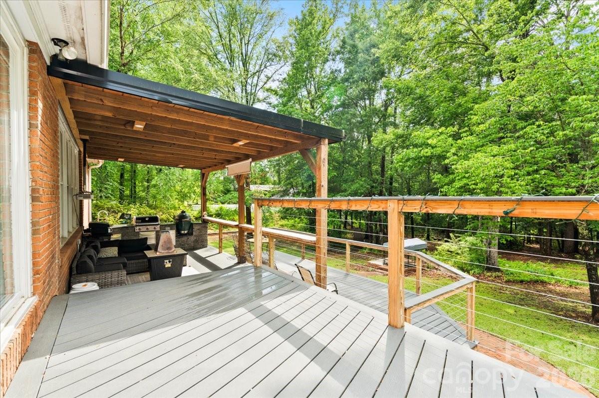 209 Fairway Road Cheraw, SC 29520 - Photo 29 of 48 a view of a deck with wooden floor and barbeque oven