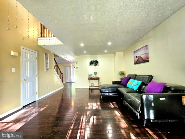 a view of staircase with wooden floor and a window