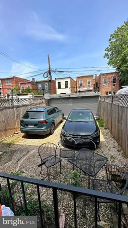 a front view of a house with swimming pool and sitting area