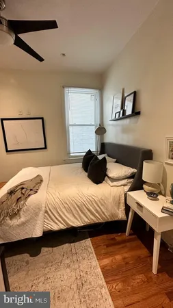 a bedroom with a bed and a table in it