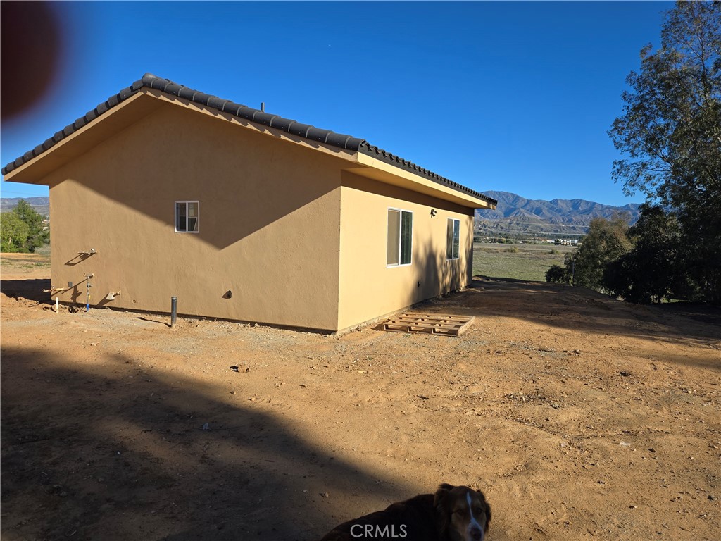 43145 Bob Cat Road Banning, CA 92220 - Photo 2 of 49 a view of a house with backyard and snow
