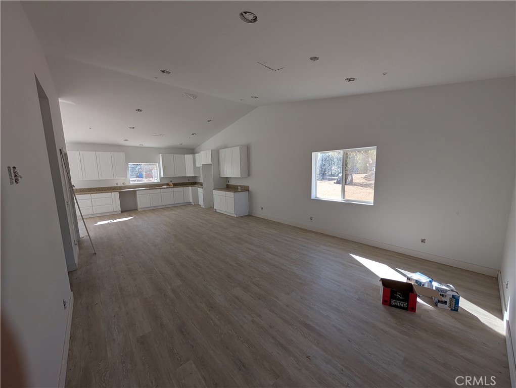 43145 Bob Cat Road Banning, CA 92220 - Photo 8 of 49 a room with stairs and a wooden floor