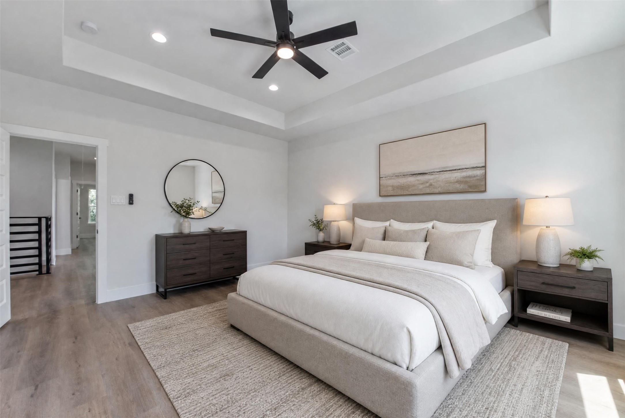 9313 Jutland Road Houston, TX 77033 - Photo 2 of 33 The spacious second-floor primary bedroom is privately situated just off the versatile flex space, offering a peaceful retreat with abundant natural light through large windows and an elegant recessed ceiling. The adjoining ensuite bath provides added comfort and convenience, creating a well-appointed primary suite designed for relaxation.