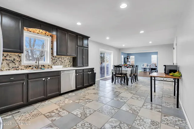 a kitchen with lots of counter top space and dining table