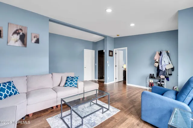 a living room with furniture and a rug