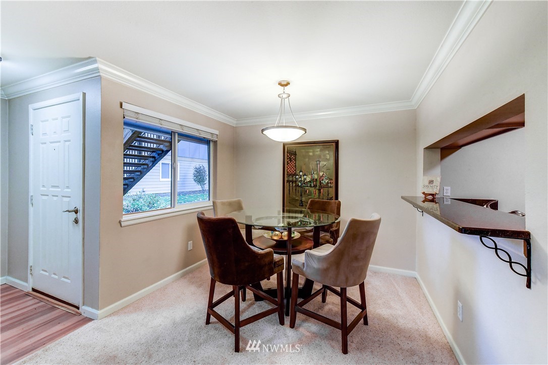 10831 Northeast 147th Lane, Unit R103 Bothell, WA 98011 - Photo 4 of 15 a dining room with furniture and window