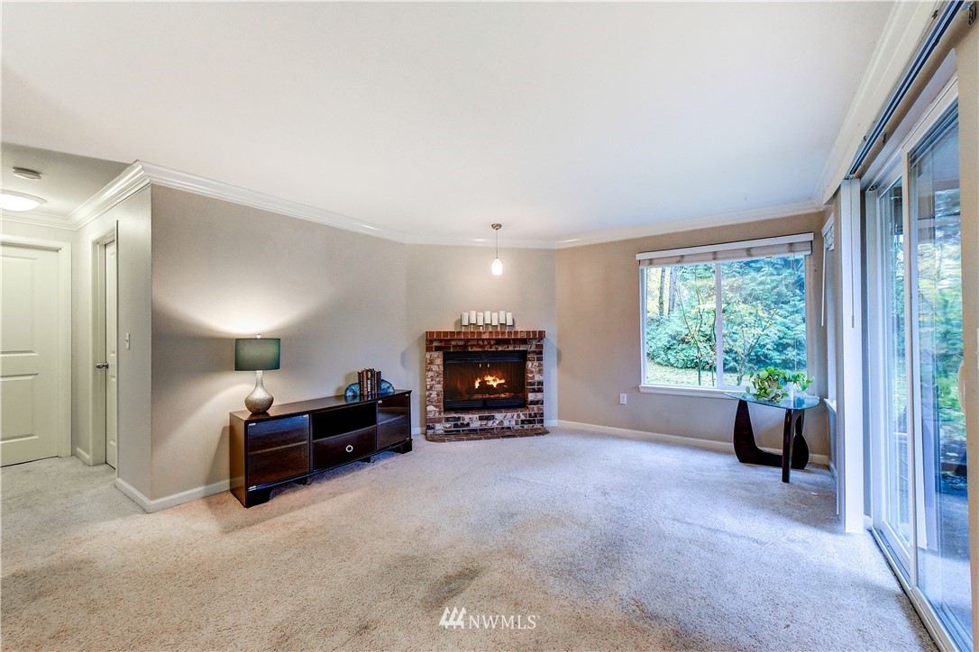 10831 Northeast 147th Lane, Unit R103 Bothell, WA 98011 - Photo 7 of 15 a view of a livingroom with furniture and a large window