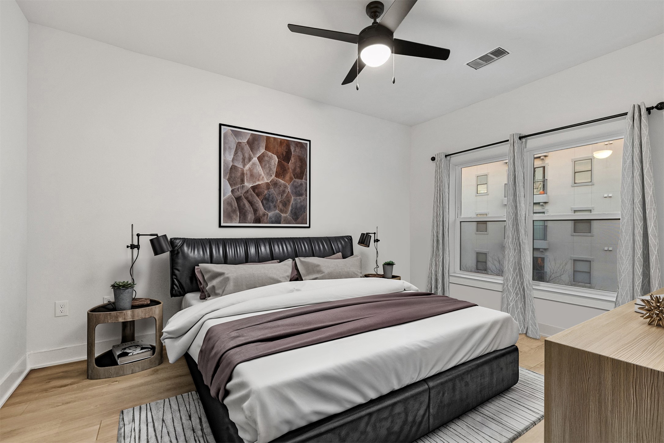 2500 Longview Street, Unit 418 Austin, TX 78705 - Photo 15 of 40 Bedroom with ceiling fan and light wood-style flooring