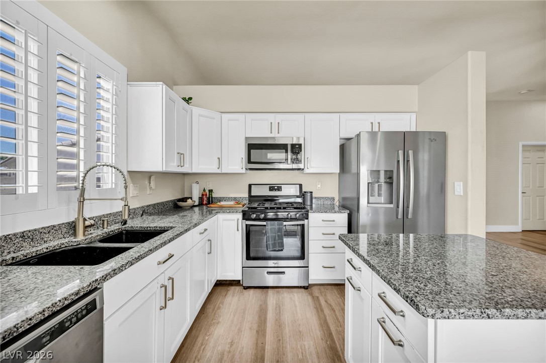 1234 Sunfire Street Henderson, NV 89014 - Photo 10 of 40 Culinary delights await in this bright kitchen, complete with ample counter space and modern appliances.