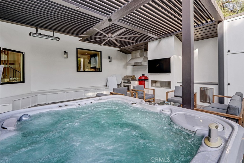 1852 6th Street Manhattan Beach, CA 90266 - Photo 19 of 60 a room with furniture and flat screen tv