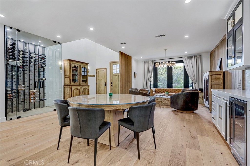 1852 6th Street Manhattan Beach, CA 90266 - Photo 36 of 60 a kitchen with stainless steel appliances a dining table chairs and granite counter tops