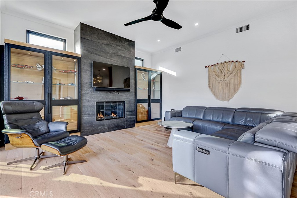 1852 6th Street Manhattan Beach, CA 90266 - Photo 41 of 60 a living room with furniture and a fireplace