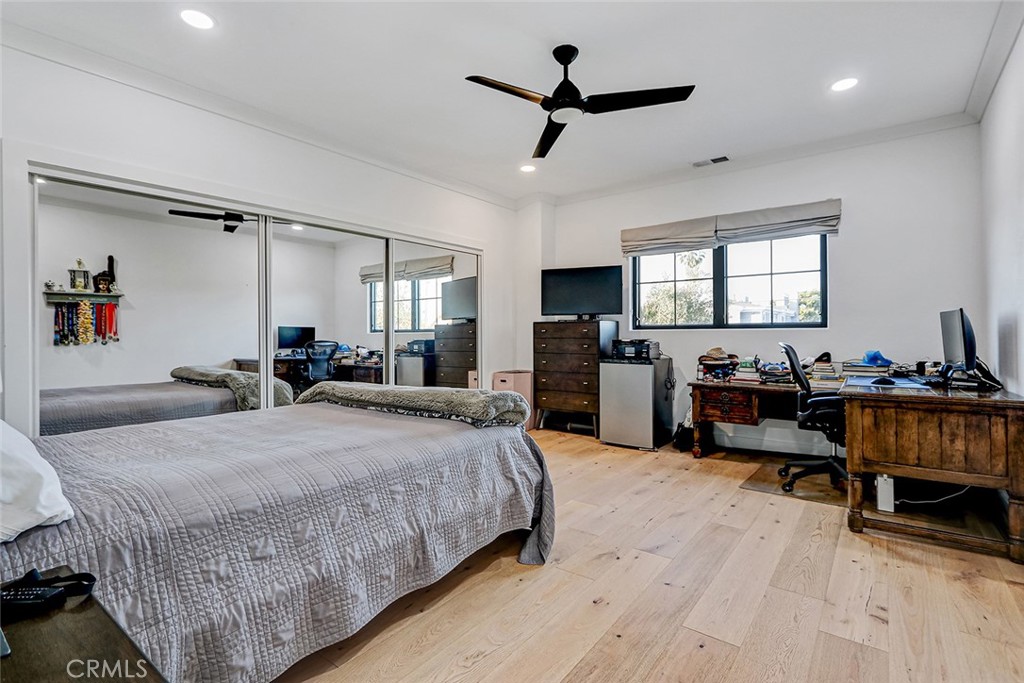 1852 6th Street Manhattan Beach, CA 90266 - Photo 54 of 60 a large bedroom with a bed and a chandelier