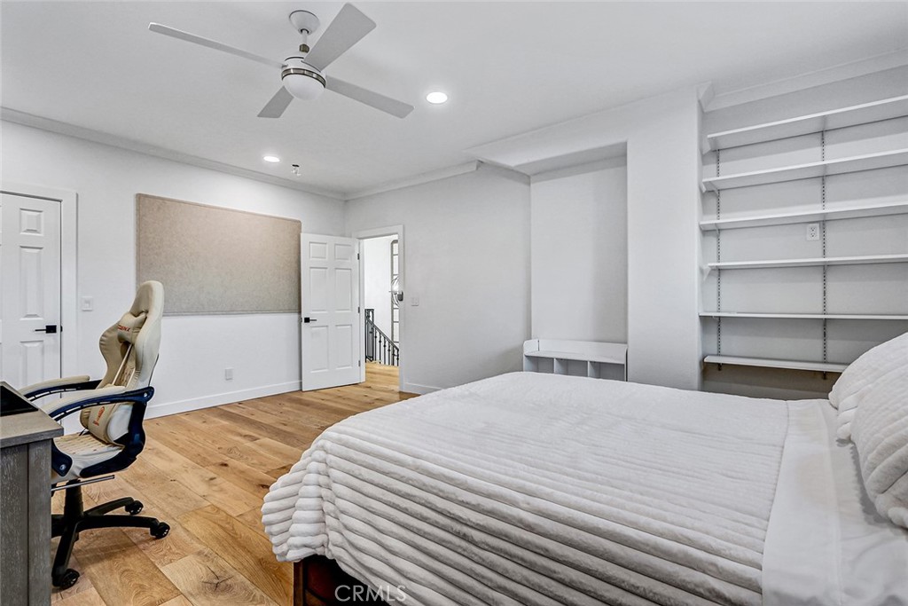 1852 6th Street Manhattan Beach, CA 90266 - Photo 56 of 60 a bedroom with a bed and a chandelier