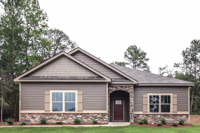 7600 Lynch Road Midland, GA 31820 - Photo 1 of 16 a front view of a house with garden