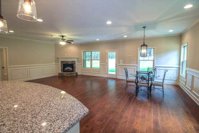 7600 Lynch Road Midland, GA 31820 - Photo 6 of 16 a view of a dining room with furniture window and wooden floor