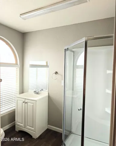 a room with white cabinets and white appliances
