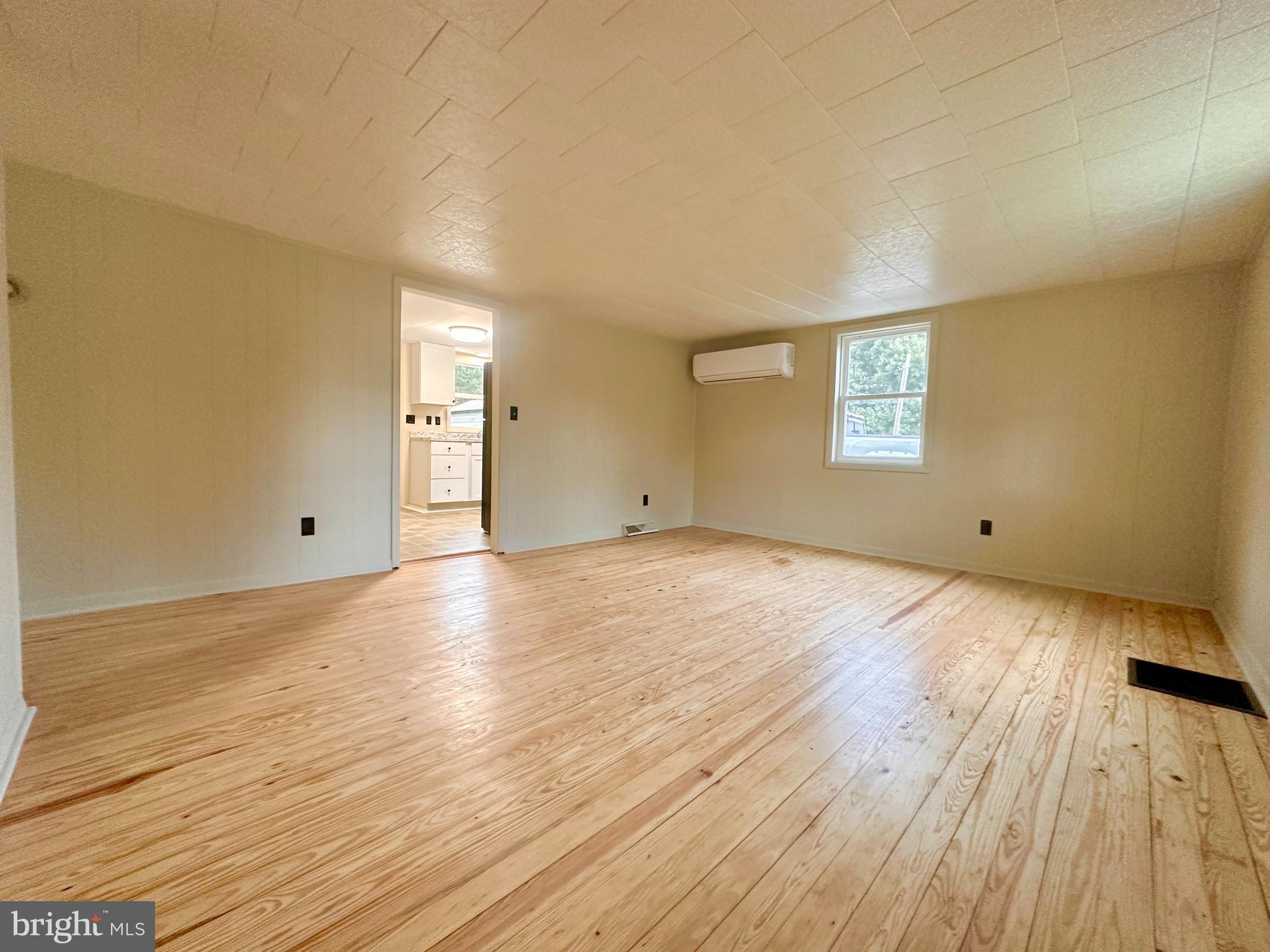 7488 Dusty Road Mercersburg, PA 17236 - Photo 12 of 27 a view of empty room with wooden floor and fan