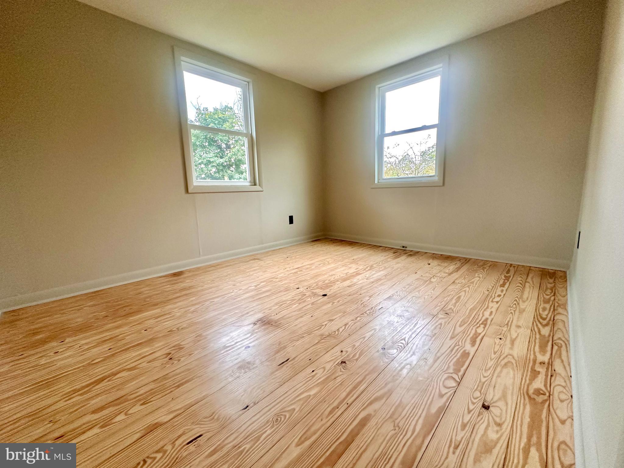 7488 Dusty Road Mercersburg, PA 17236 - Photo 14 of 27 a view of an empty room with wooden floor and a window