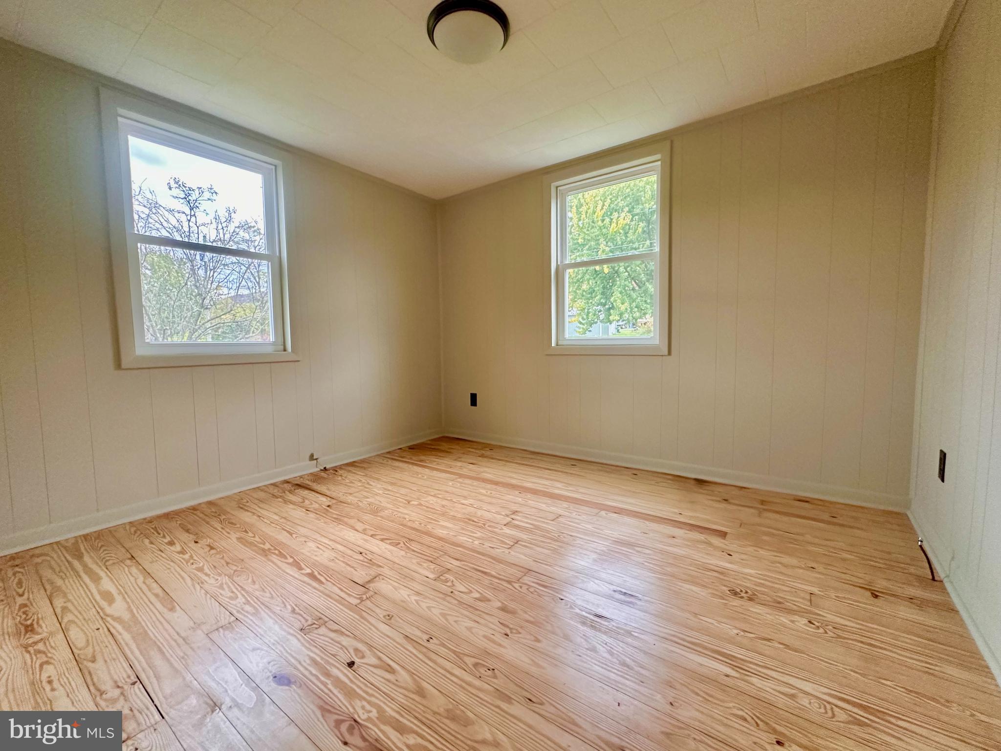 7488 Dusty Road Mercersburg, PA 17236 - Photo 15 of 27 a view of an empty room with wooden floor and a window