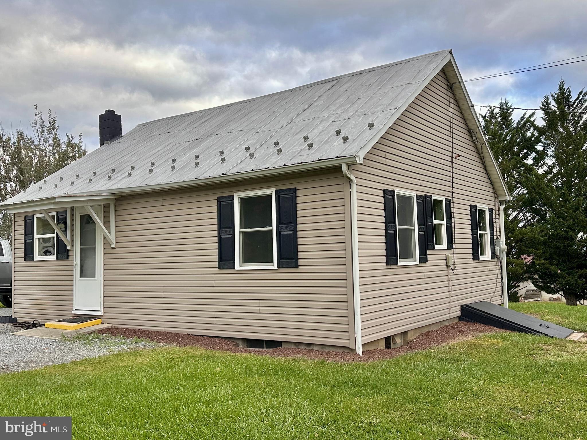 7488 Dusty Road Mercersburg, PA 17236 - Photo 24 of 27 a view of a house with a yard and sitting area