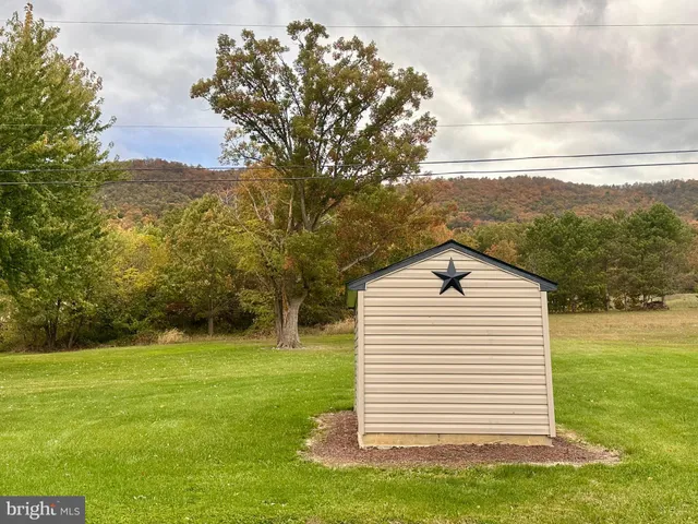 a view of a backyard of the house