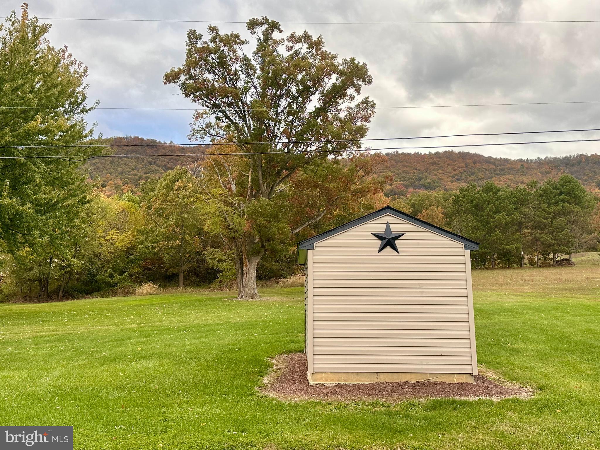 7488 Dusty Road Mercersburg, PA 17236 - Photo 3 of 26 a view of a backyard of the house