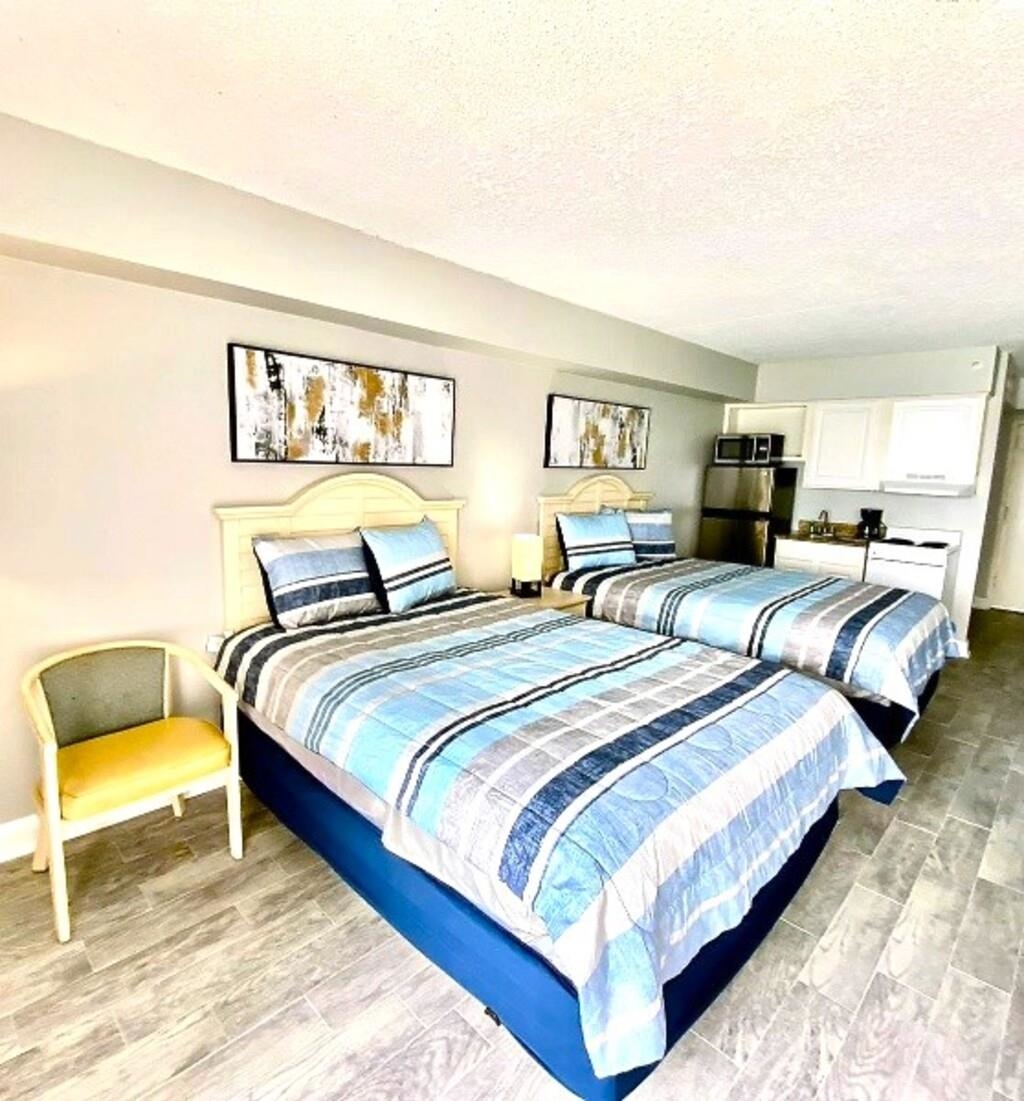 1207 South Ocean Boulevard, Unit 20809 Myrtle Beach, SC 29577 - Photo 3 of 19 Bedroom featuring a textured ceiling and light wood-type flooring