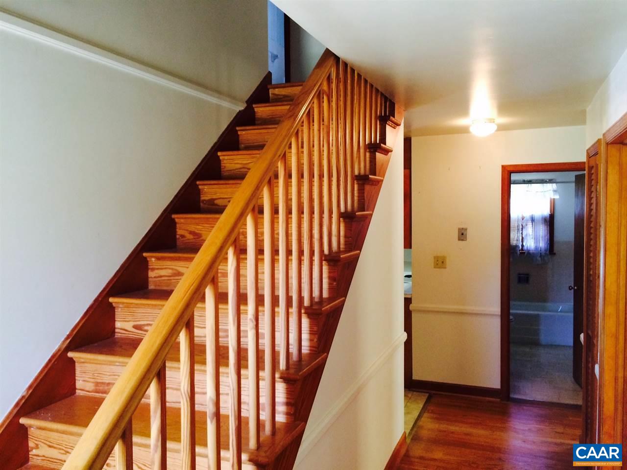 1259 Howardsville Road Staunton, VA 24401 - Photo 7 of 9 an entryway with wooden floor and stairs