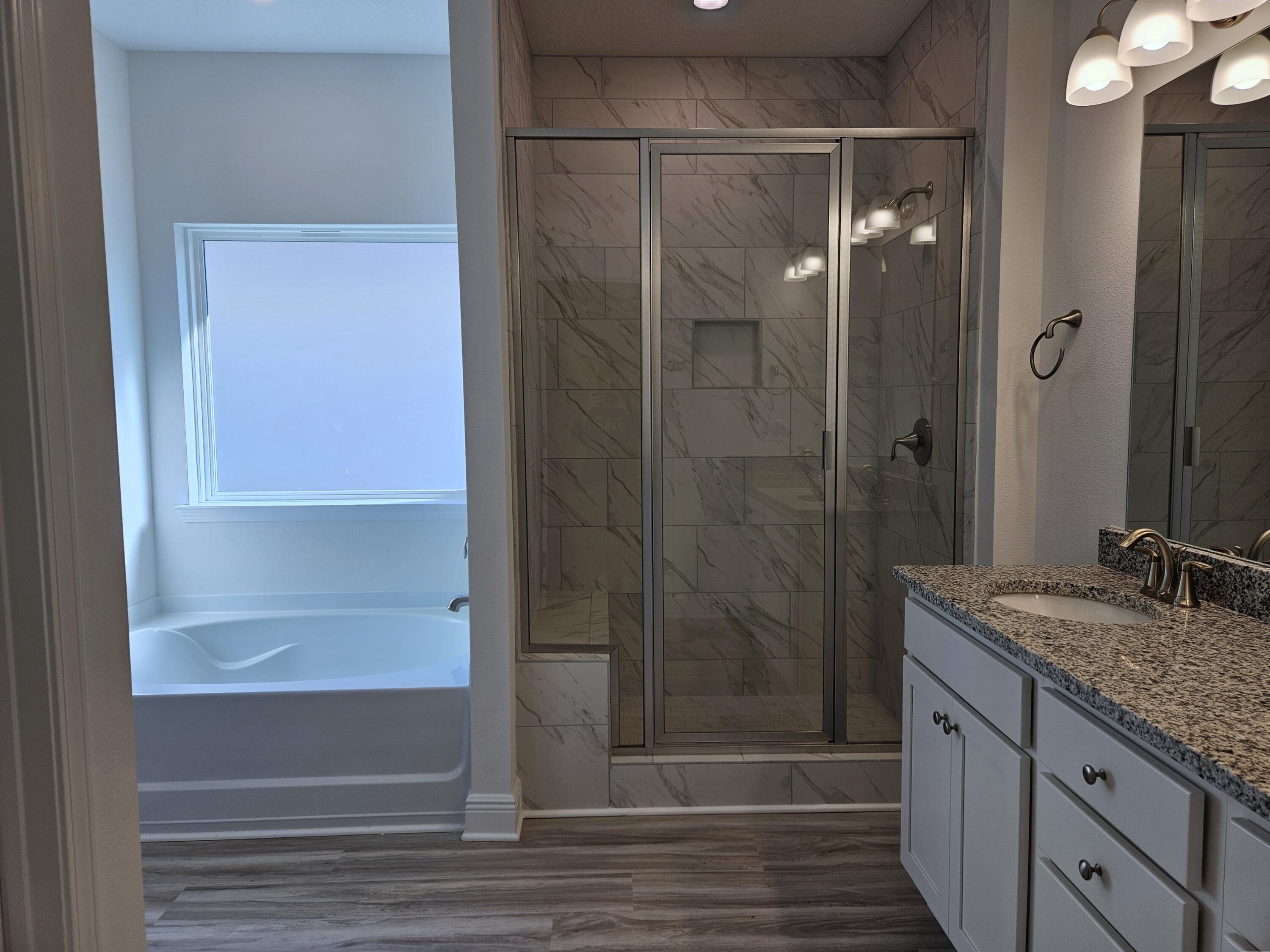 7 Nest Lane Santa Rosa Beach, FL 32459 - Photo 11 of 16 a bathroom with a granite countertop sink mirror and shower