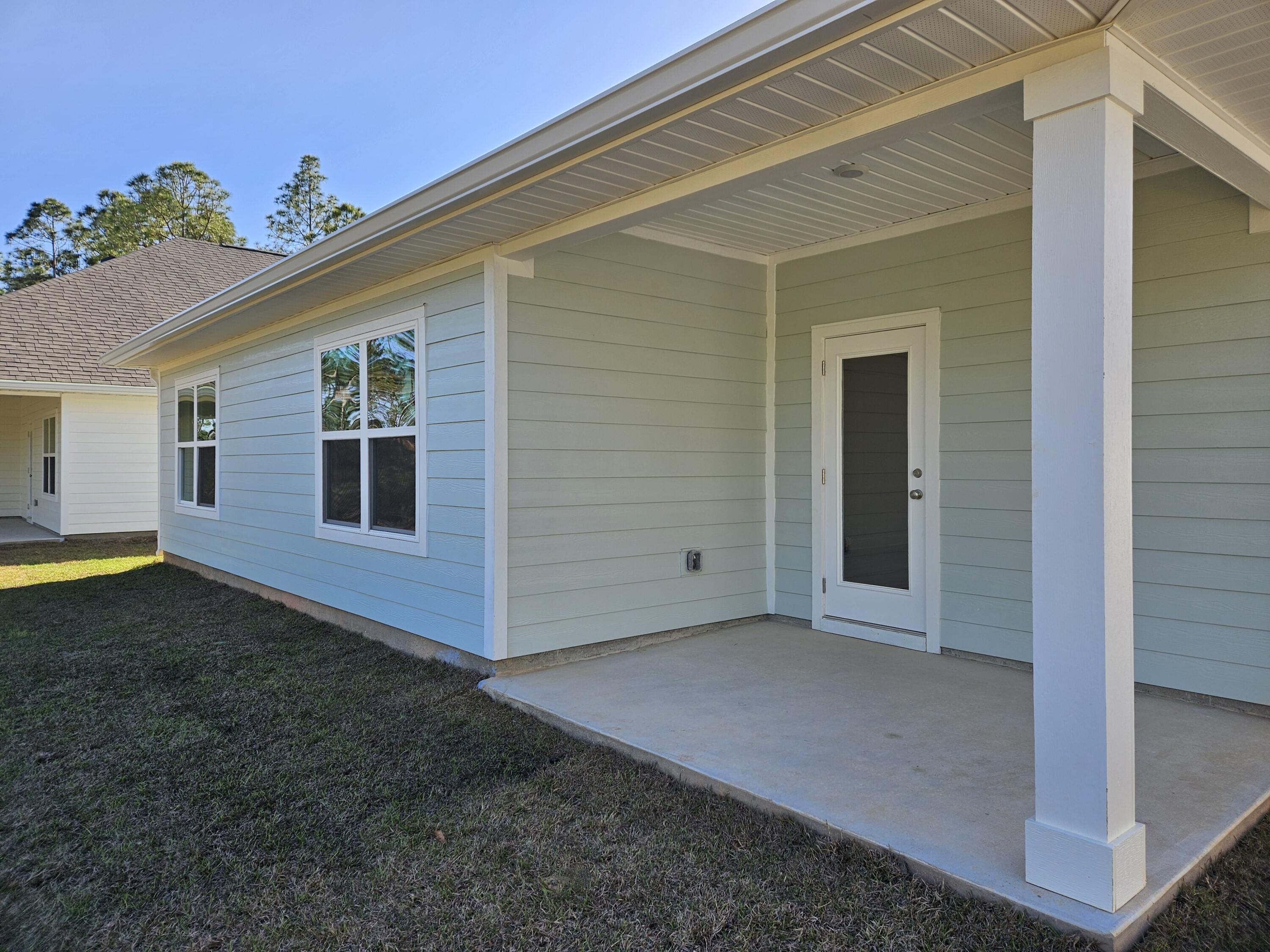 7 Nest Lane Santa Rosa Beach, FL 32459 - Photo 15 of 16 a view of a house with backyard and porch
