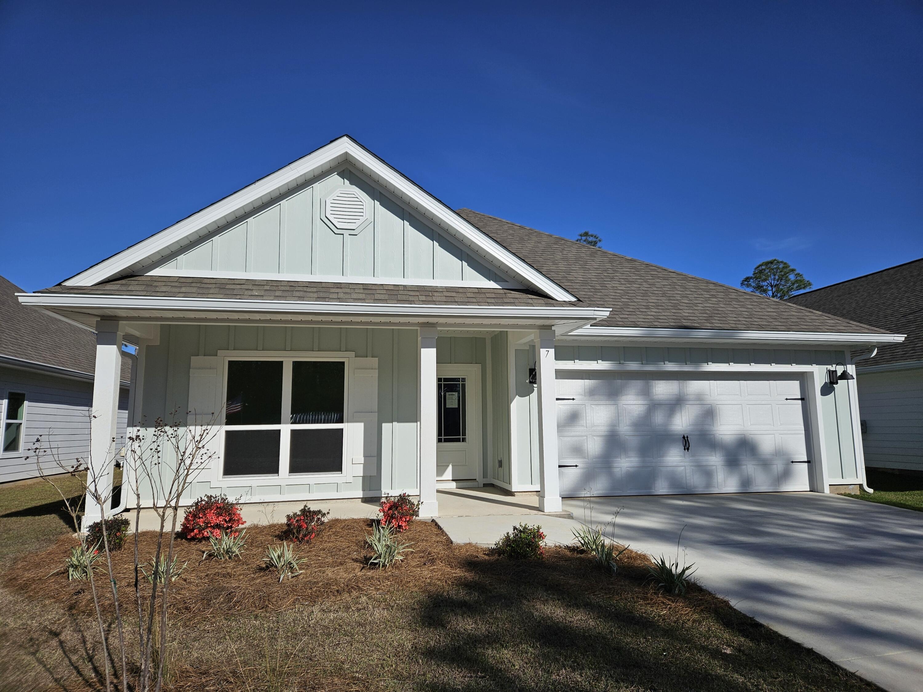 7 Nest Lane Santa Rosa Beach, FL 32459 - Photo 2 of 16 a front view of a house with a garage