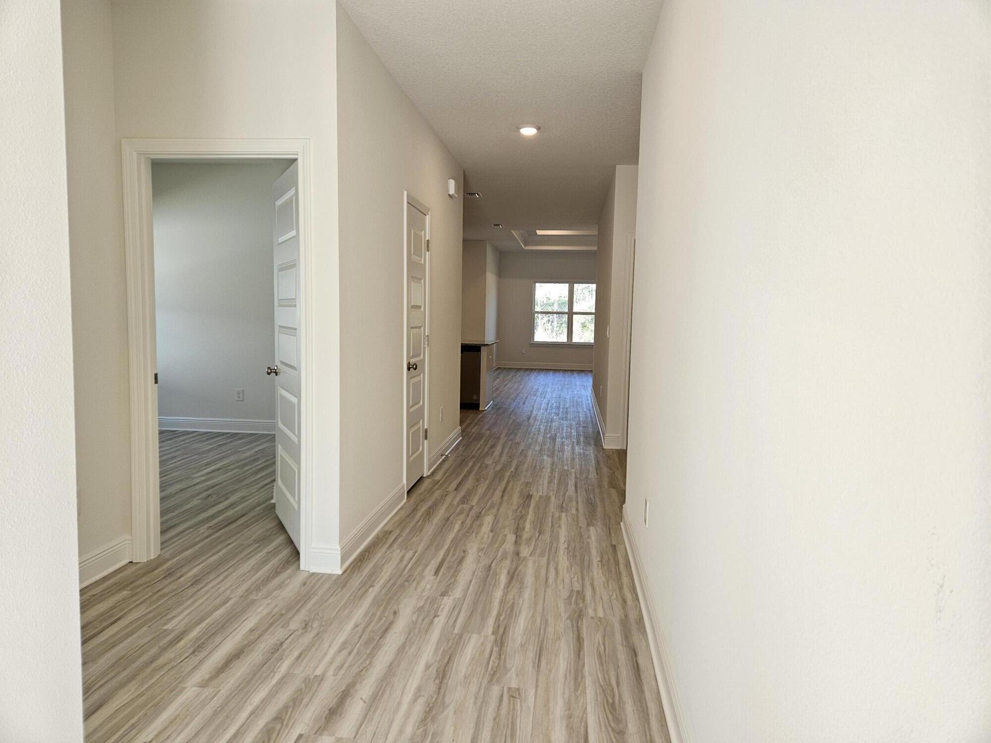 7 Nest Lane Santa Rosa Beach, FL 32459 - Photo 3 of 16 a view of a room with wooden floor
