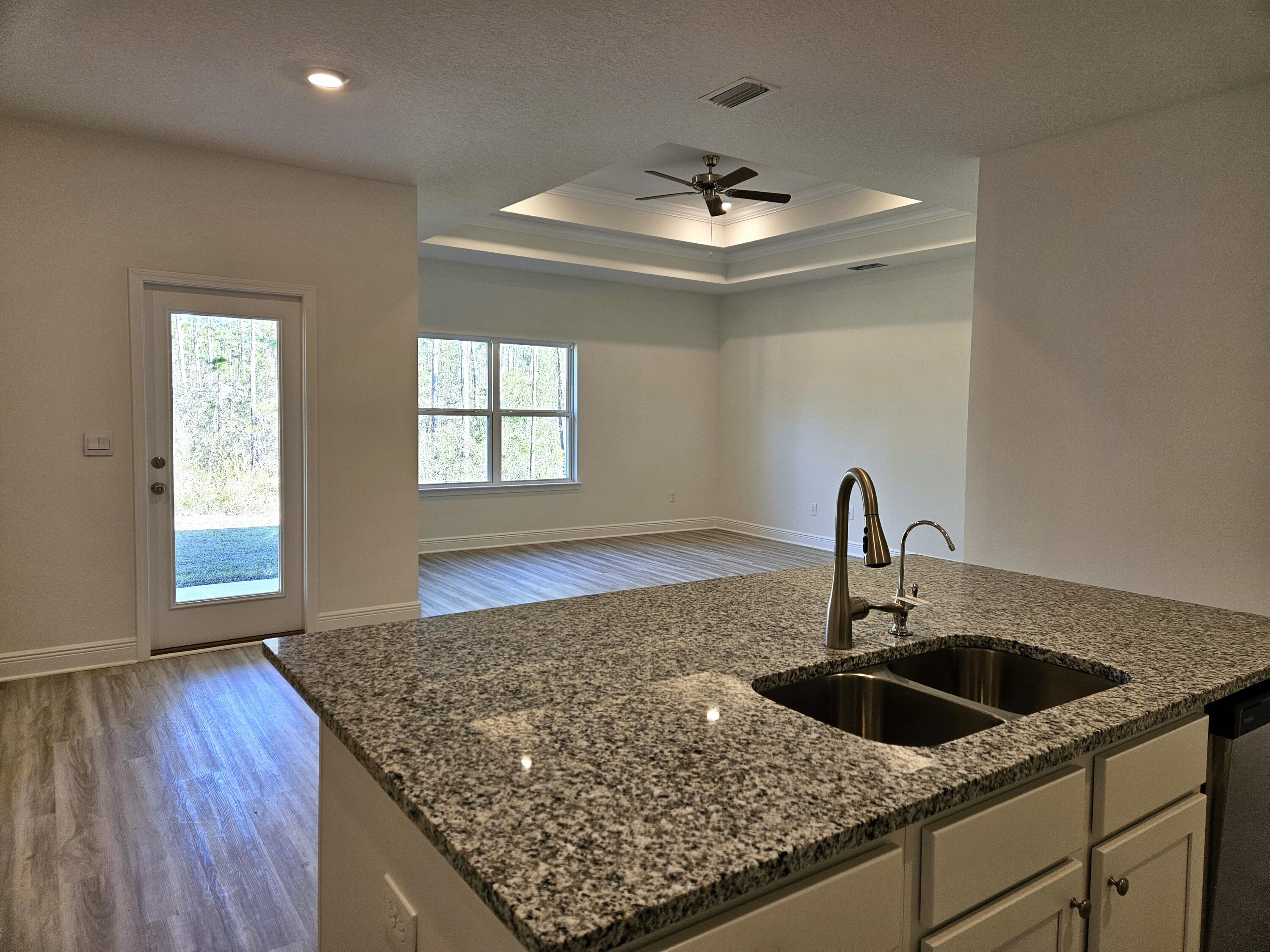 7 Nest Lane Santa Rosa Beach, FL 32459 - Photo 6 of 16 a kitchen with a sink a counter top and a stove