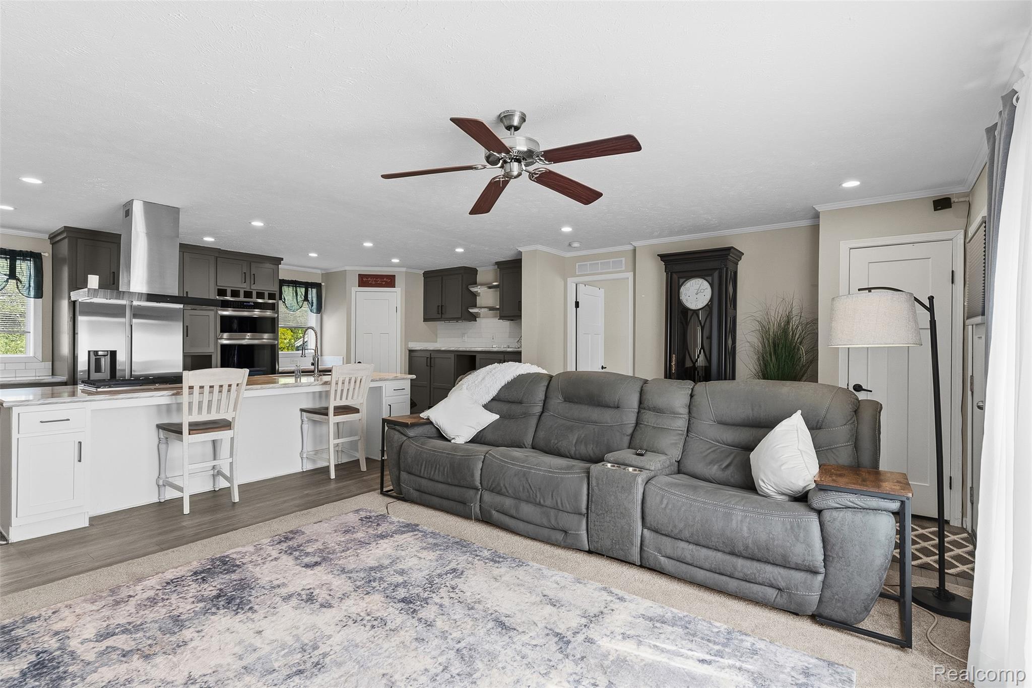6450 Prince Boulevard Fenton, MI 48430 - Photo 8 of 31 Open-concept living space featuring wood-finish flooring and recessed lighting