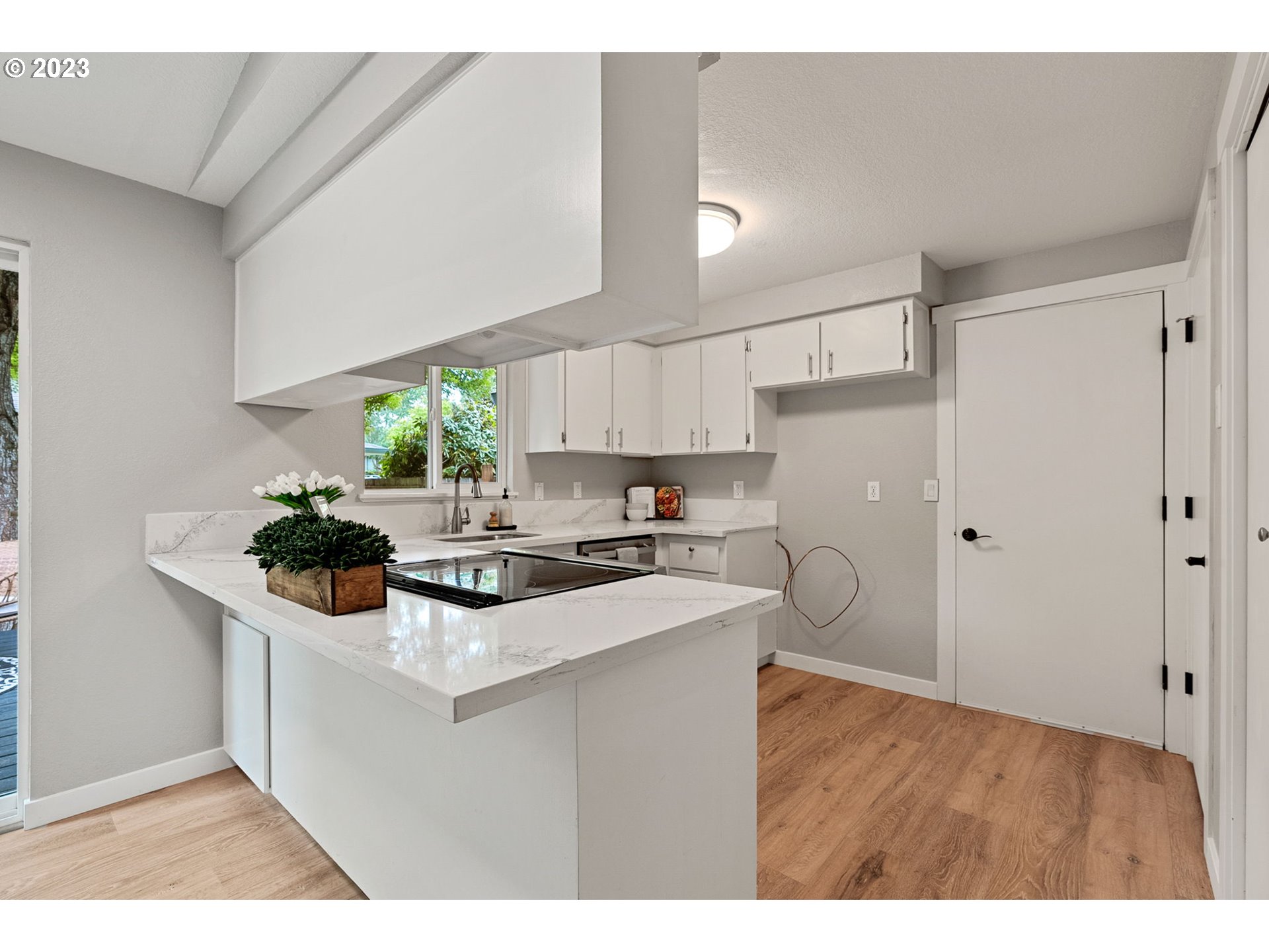 5830 Southwest 177th Avenue Beaverton, OR 97007 - Photo 15 of 41 a kitchen with stainless steel appliances a sink a stove a refrigerator cabinets and living room view