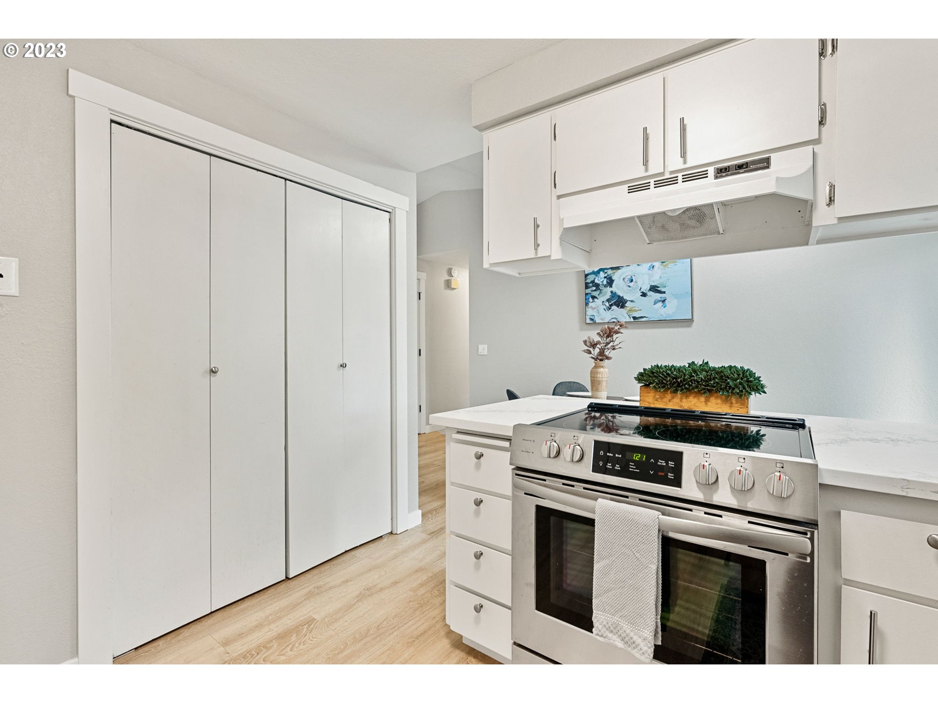 5830 Southwest 177th Avenue Beaverton, OR 97007 - Photo 17 of 41 a kitchen with white cabinets and appliances