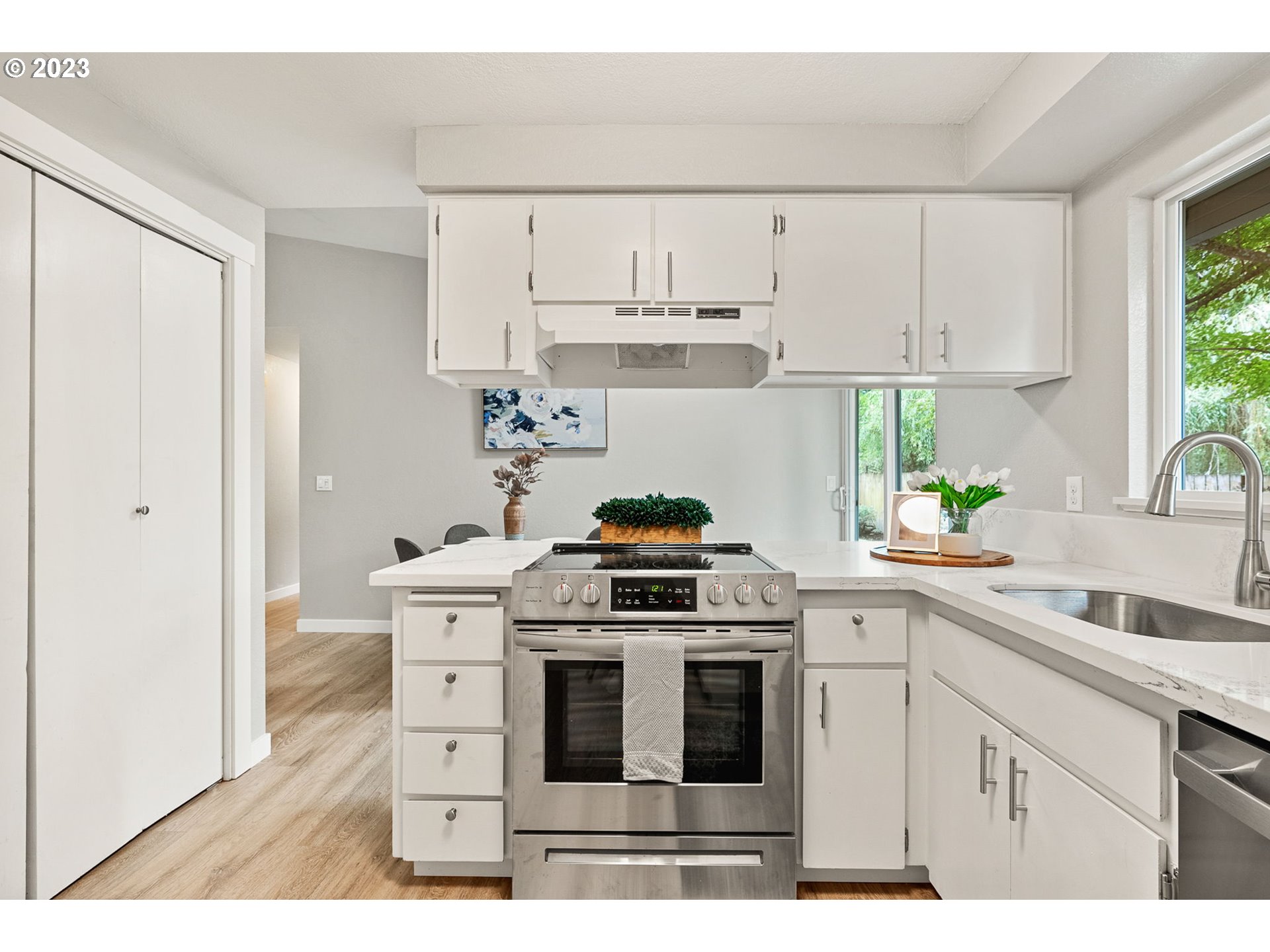 5830 Southwest 177th Avenue Beaverton, OR 97007 - Photo 18 of 41 a kitchen with white cabinets stainless steel appliances and sink