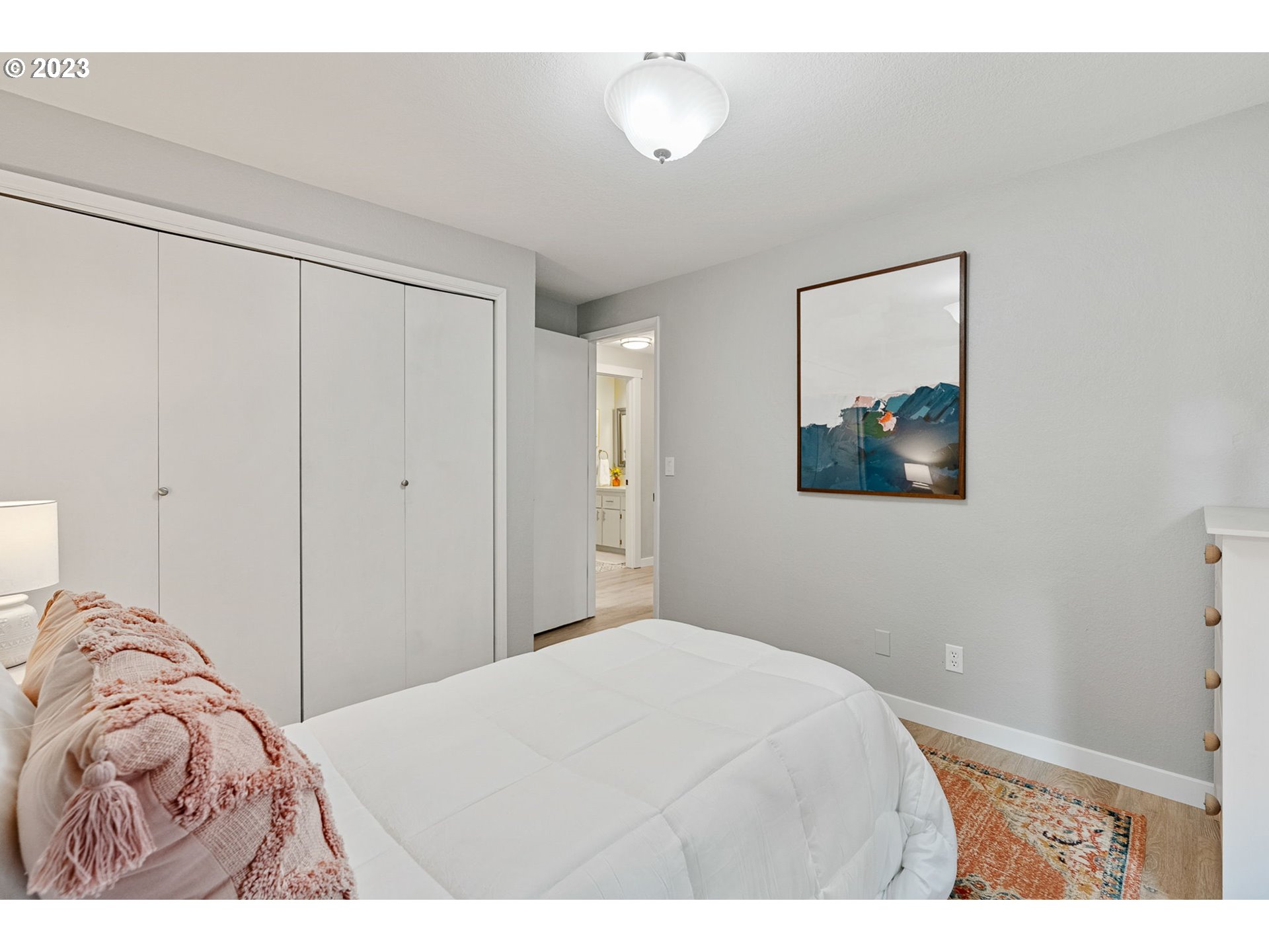 5830 Southwest 177th Avenue Beaverton, OR 97007 - Photo 26 of 41 a bedroom with a bed and a painting on the wall